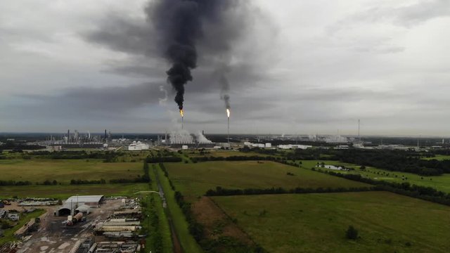 Chemical Plant Conducting Controlled Flaring to Burn Off Excess Materials in Channelview near Houston, Texas Filmed by Drone