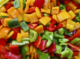 Sliced multicolored fresh Bulgarian pepper - vitamins and health benefits