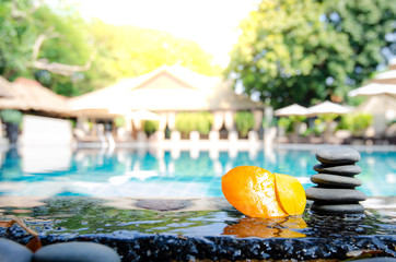 stones has set up to be a stone lines next and orange leaf to water, stone lines,stone used in spa,select focus