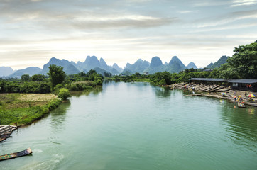 Obraz premium Beautiful karst mountains are visible on blue sky background on summer sunny day.