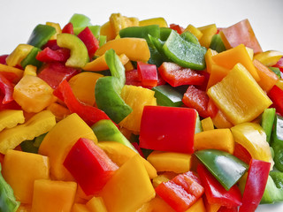 Sliced multicolored fresh Bulgarian pepper - vitamins and health benefits