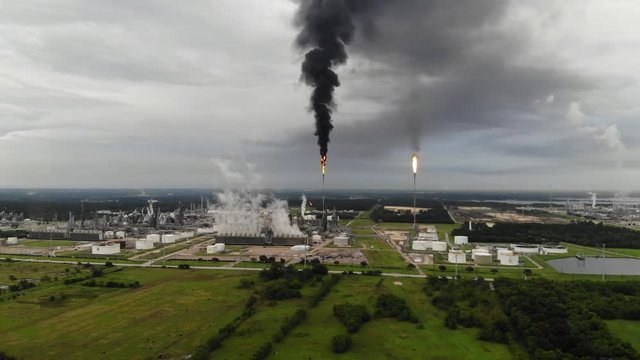 Chemical Plant Conducting Controlled Flaring to Burn Off Excess Materials in Channelview near Houston, Texas Filmed by Drone