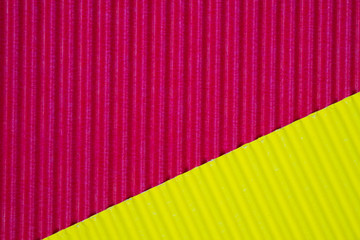 Red and yellow corrugated paper texture, use for background. vivid colour with empty space for add text or object.