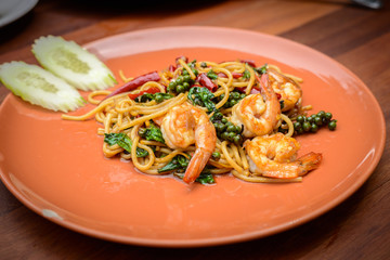 Stir-fried Spicy Spaghetti Seafood Thai food Style (Spaghetti Pad Kee Mao) in Orange Dish