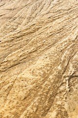 Natural brown rock texture eroded by the water