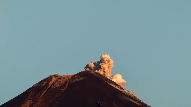 Reventador Volcano erupting at dawn, September 2016. The mountain is situated in a remote part of the Ecuadorian Amazon surrounded by rainforest. 