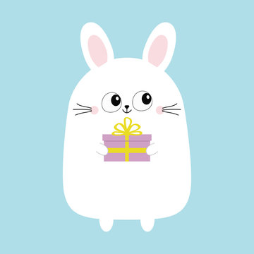 White bunny rabbit holding gift box. Funny head face. Big eyes. Cute kawaii cartoon character. Baby greeting card template. Happy Birthday sign symbol. Blue background. Flat design.
