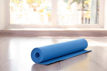 Yoga mat on floor indoors