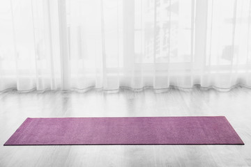 Yoga mat on floor indoors