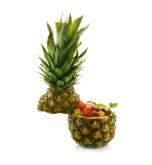 Pineapple bowl with delicious fresh fruit salad on white background