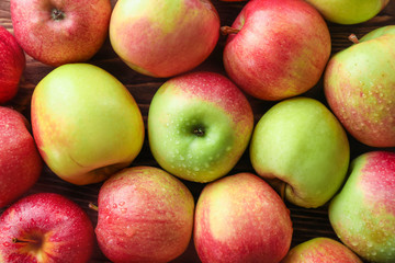 Ripe juicy apples on table, top view