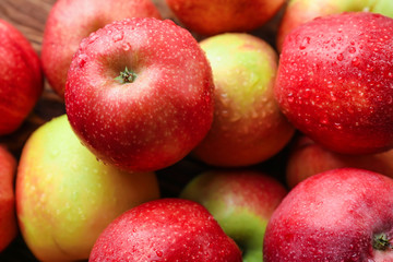 Fototapeta na wymiar Many ripe juicy apples with water drops