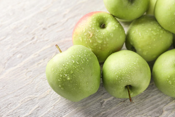 Ripe fresh apples on light table