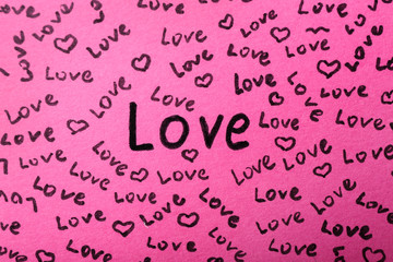 Written words LOVE on color background