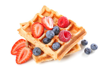 Delicious waffles with berries on white background