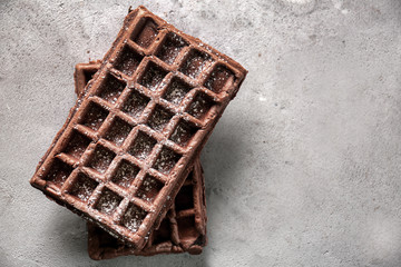 Delicious waffles on grey table