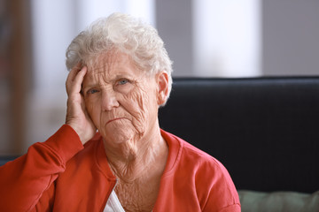 Depressed elderly woman at home