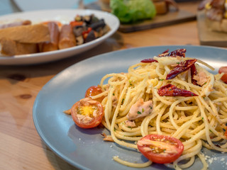 Spicy tuna olive spaghetti by top view image. New fusion menu between Italian traditional food with Thai style. Food design for who like hot and spicy tasty. Temptation menu for every meal in day.