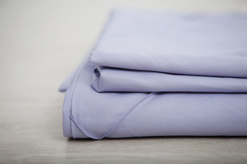 Bedclothes on the bed made with pillows.