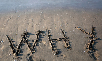 text WHY on the beach