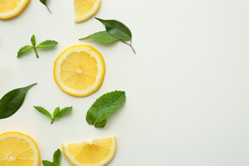 Flat lay composition with lemon slices on white background