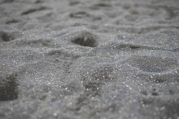 Fototapeta na wymiar Black sand macro background, beach, macro, texture