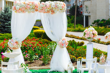 Arch for the wedding ceremony, decorated in delicate colors
