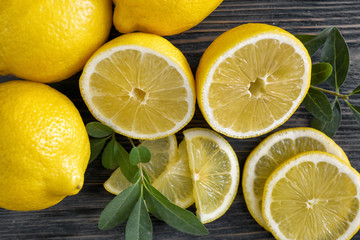 Fototapeta na wymiar Fresh ripe lemons on wooden background