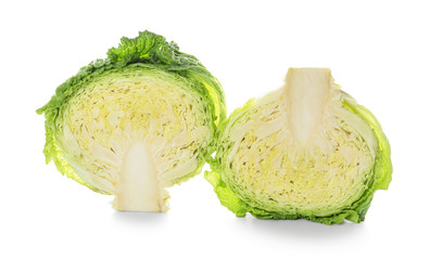 Halves of savoy cabbage on white background
