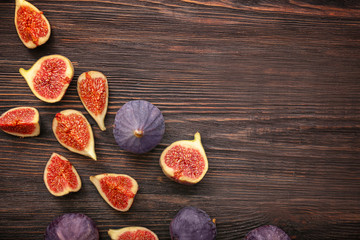 Fresh ripe figs on wooden table