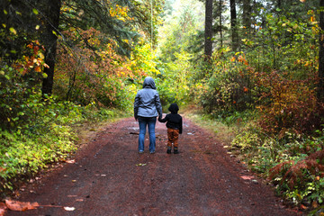 mom and son walking on a trail