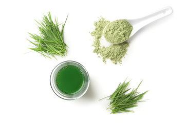 Flat lay composition with wheat grass juice on white background