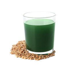 Glass of wheat grass juice on white background