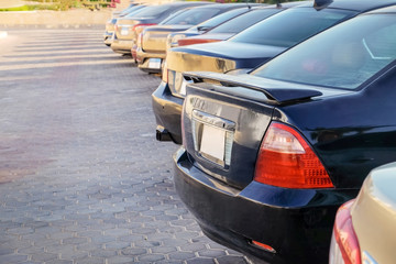Fototapeta premium Row of parked cars on city street