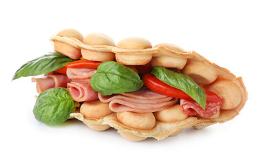 Delicious bubble waffle with vegetables and meat on white background