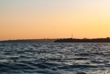 Fototapeta na wymiar waves at sunset, Dnieper river, river landscape,