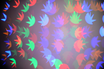 Fototapeta premium Blurred view of beautiful lights on dark background