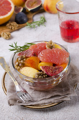 Salad from different raw fruits