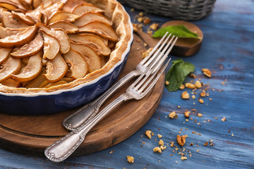 Delicious pear cake on wooden board