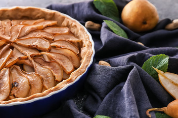 Delicious pear cake on table