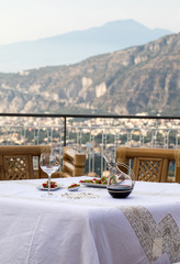 Prepared for supper table on the terrace overlooking the Bay of Naples and  Vesuvius. Sorrento. Italy
