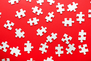 Pieces of jigsaw puzzle on color background