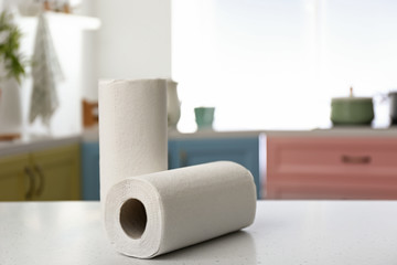 Rolls of paper towels on kitchen table