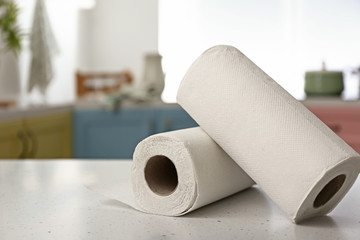 Rolls of paper towels on kitchen table