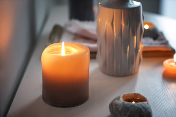 Beautiful burning candles on table indoors