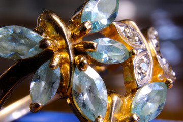 Gold jewel with precious stones