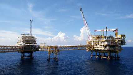 Oil and gas industry and hard work. Offshore construction platform for production oil and...