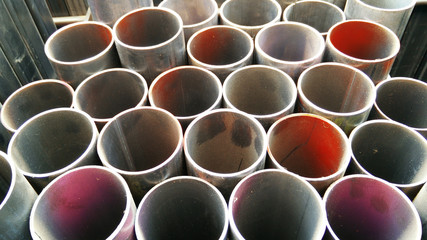 Steel pipes profile stack. New square metal pipes in stock. Stack of steel, Steel material. Steel...