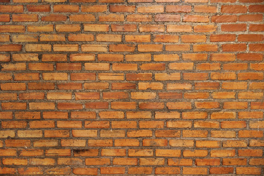 Background of old vintage brick wall. red brick wall texture grunge background with vignetted corners, may use to interior design.