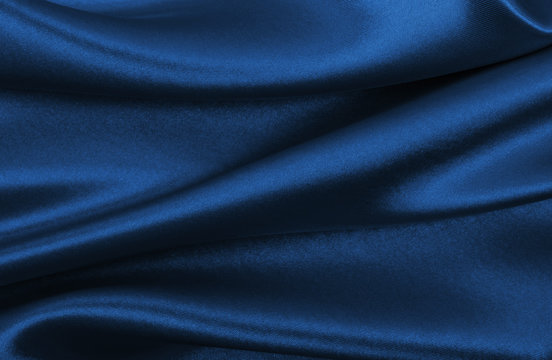 Smooth elegant blue silk or satin luxury cloth texture as abstract